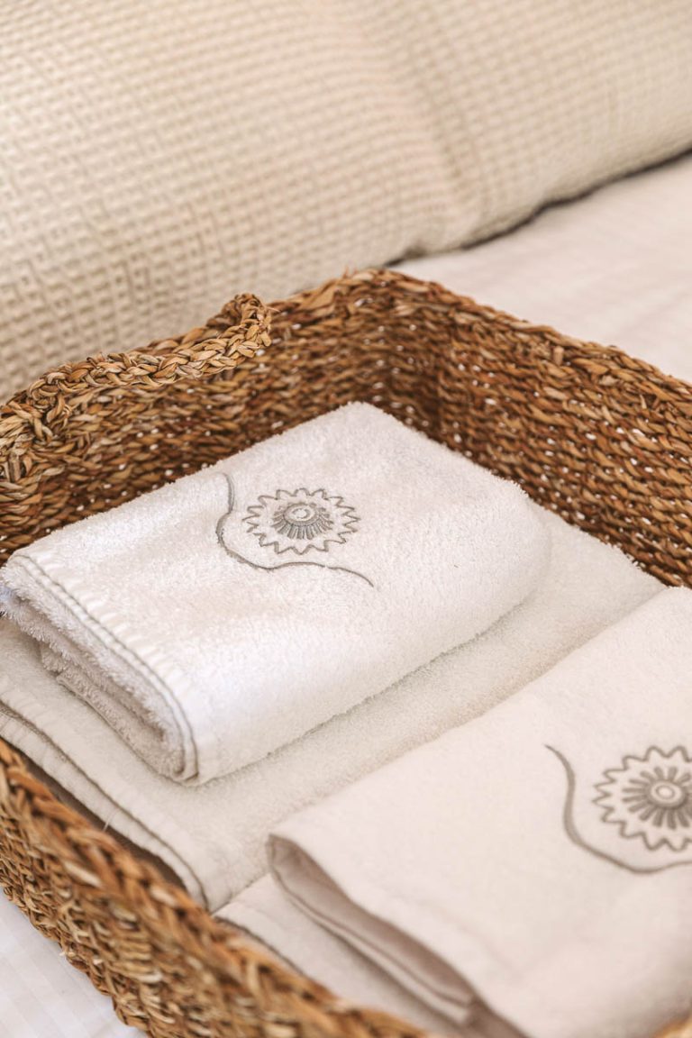 a basket with towels in it